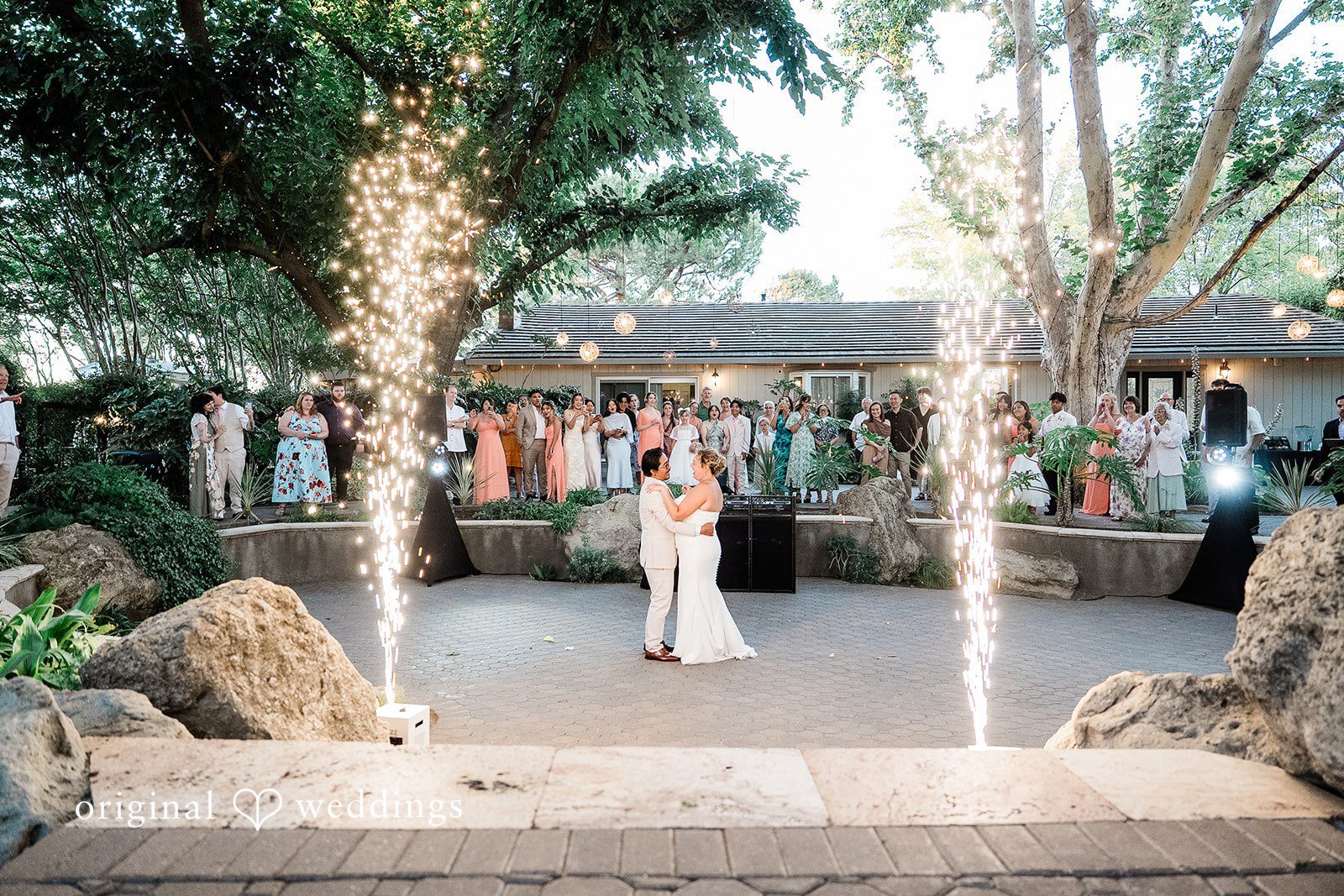 Lindsay + Ryan A bride and groom enjoying a dramatic sparkler fountain entrance at their reception venue.
