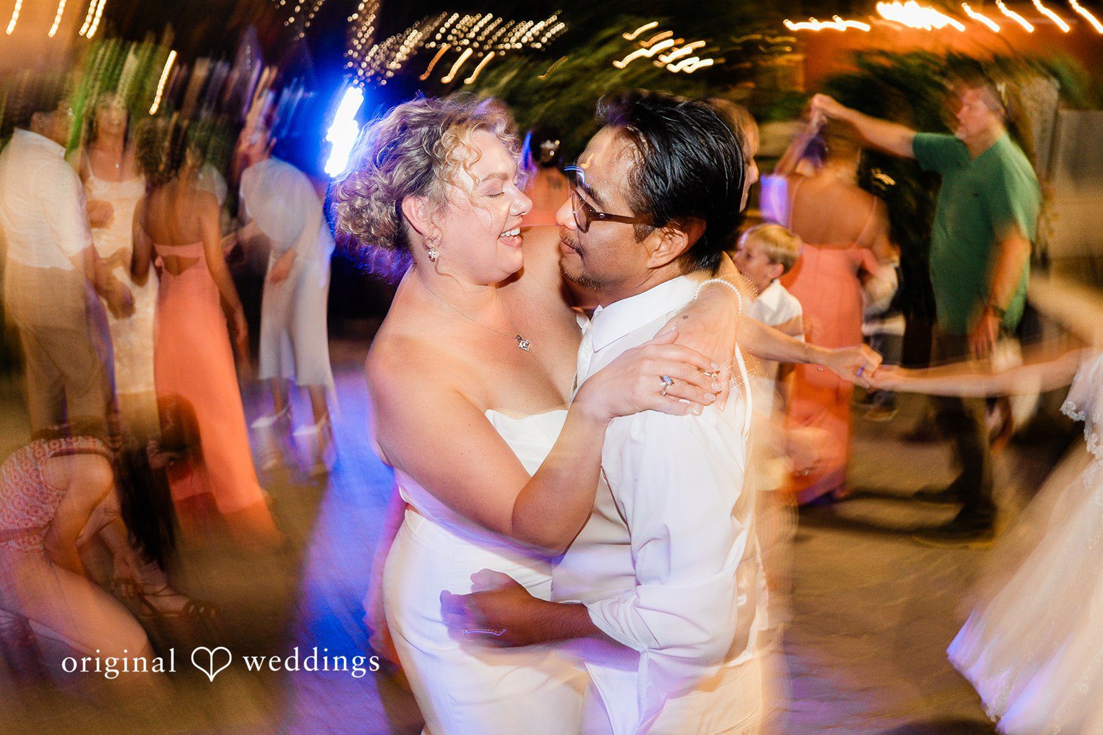Lindsay + Ryan A bride and groom holding each other close while slow dancing at their reception.