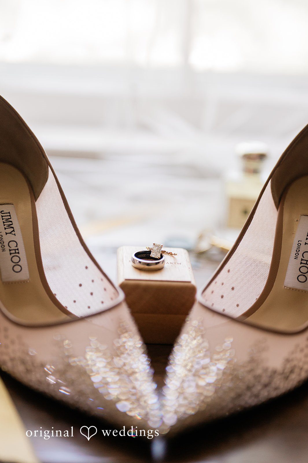 A detail shot of the bride's shoes and ringringss
