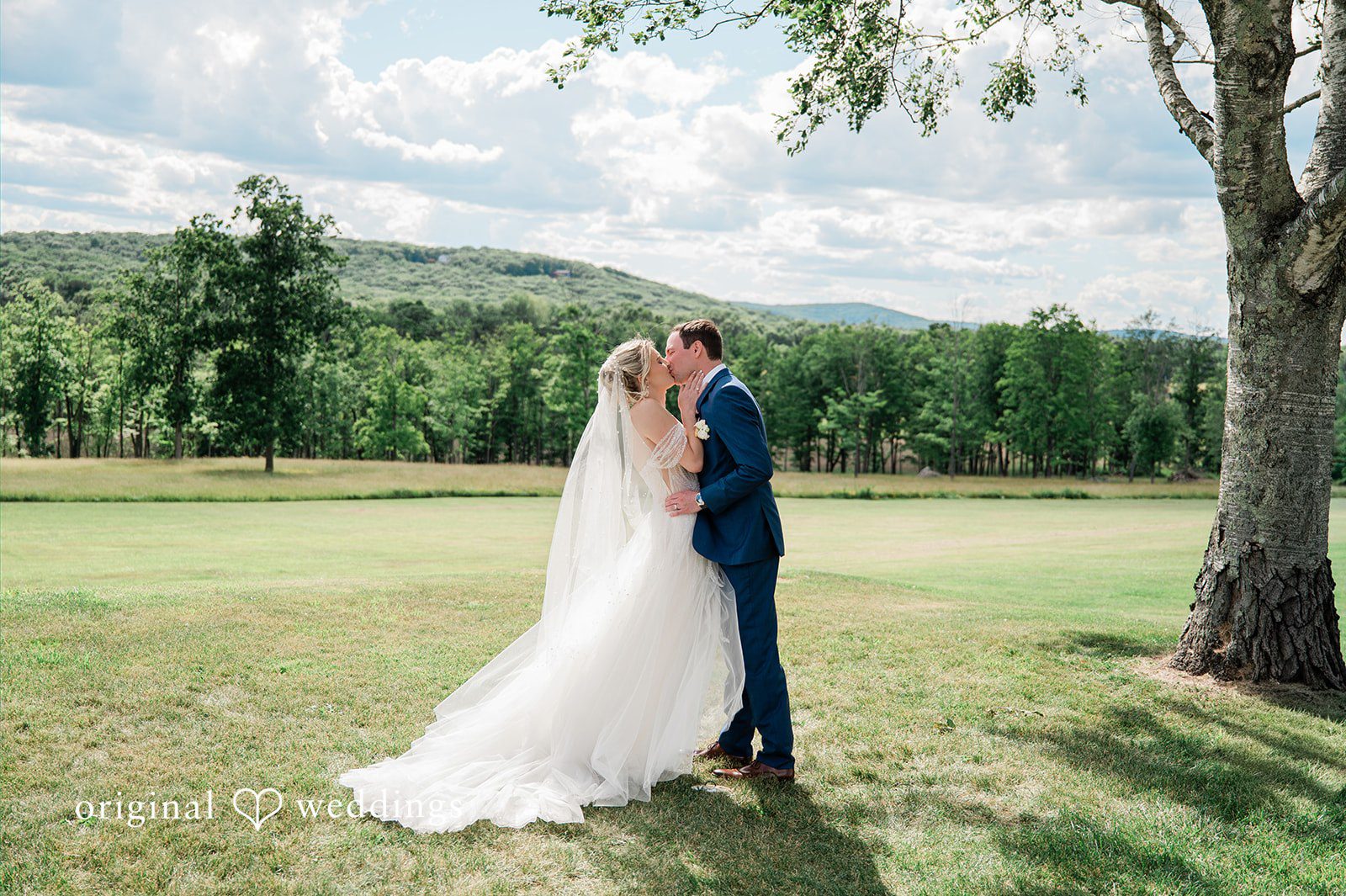 The couple shares a kiss