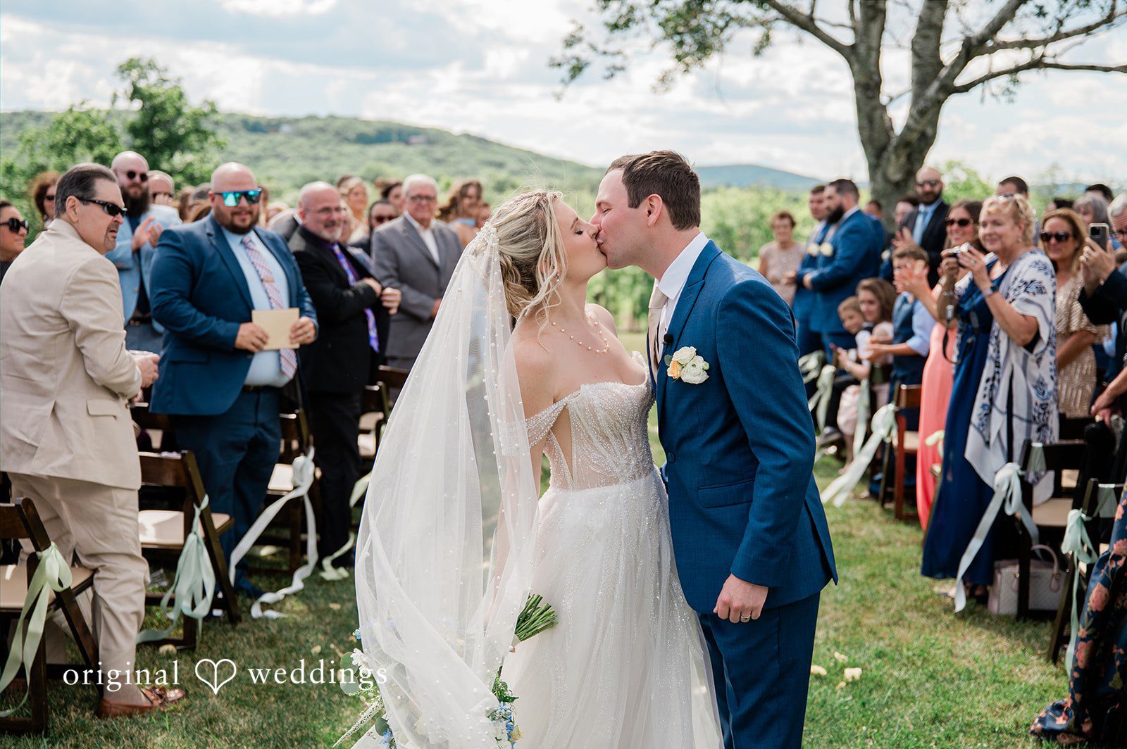 The couple shares a romantic kiss
