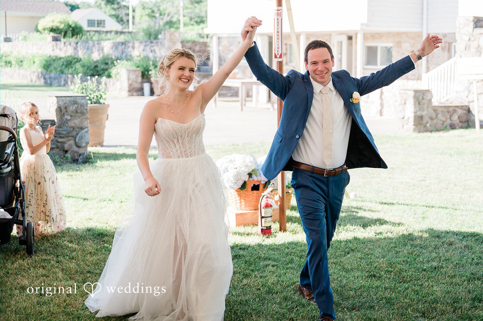 The couple makes a joyful entrance to their wedding reception