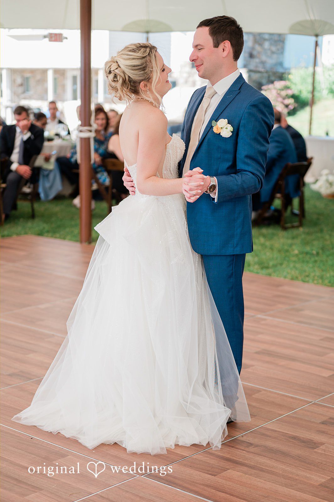 The couple takes their first dance