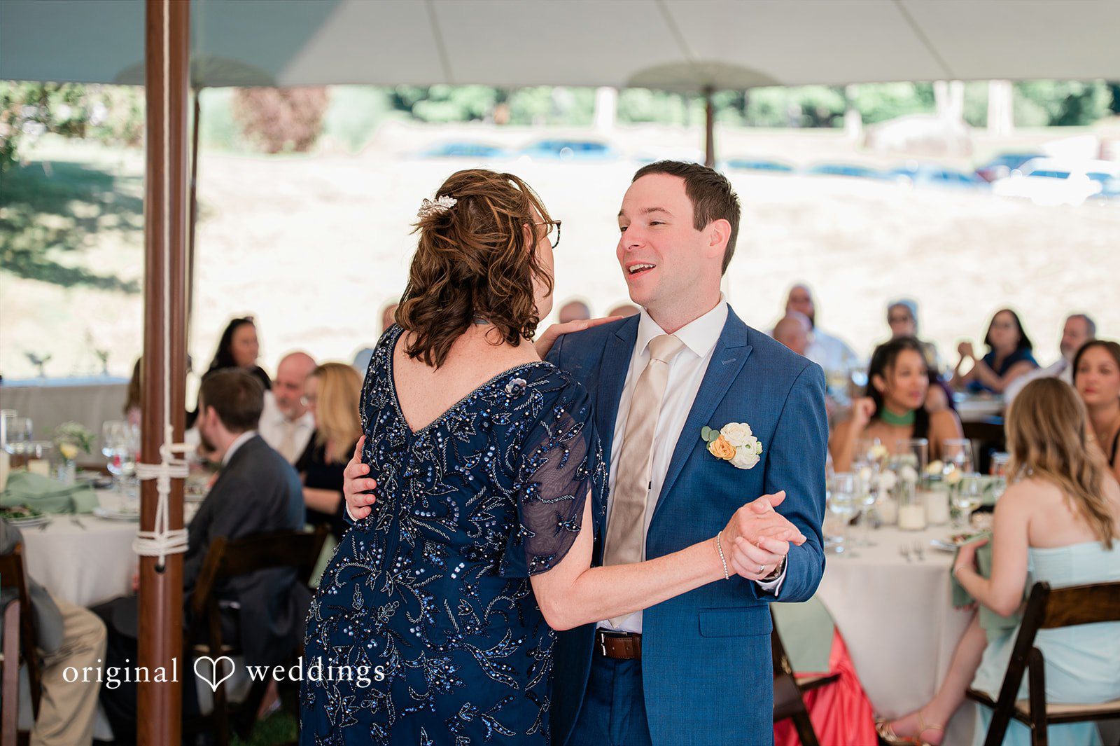 The groom dances with his mother