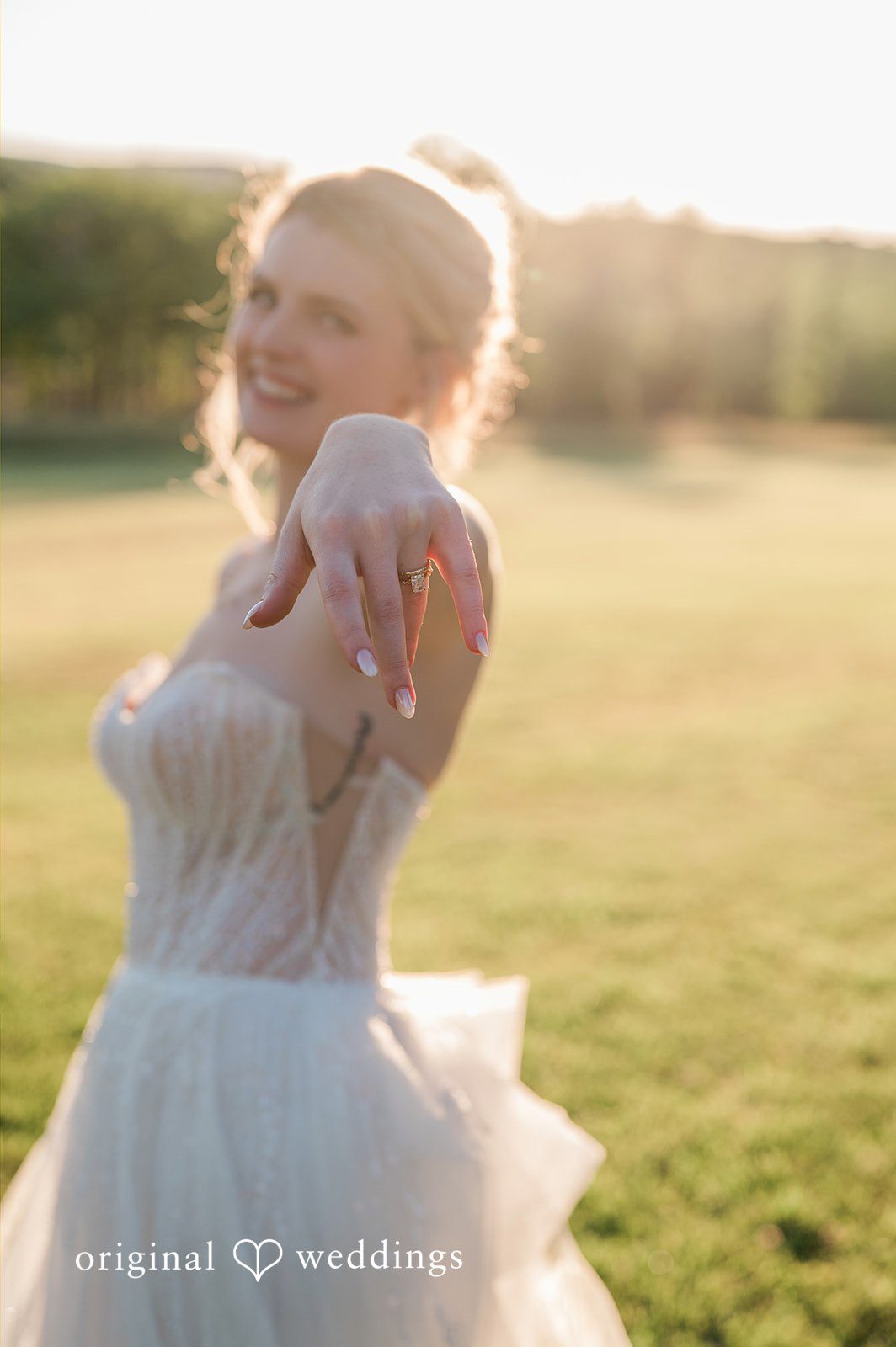 The bride shows off her ring