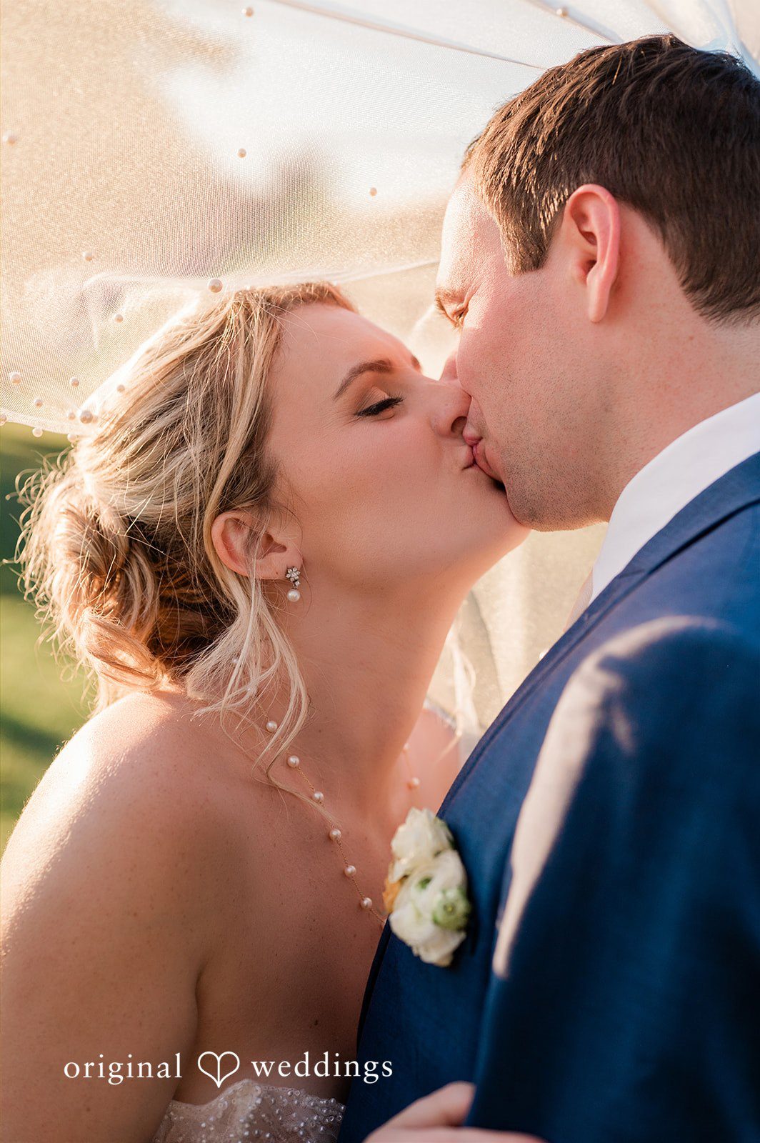 The couple shares a kiss