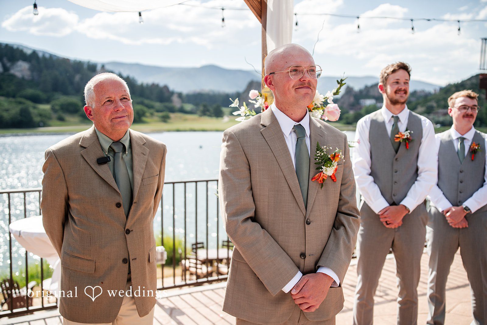 Mckenna + Ryan Three men wearing tan suits standing together.