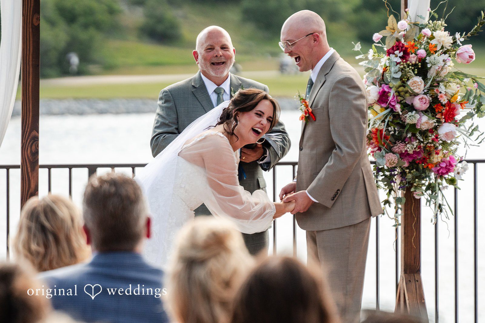 Mckenna + Ryan A bride and groom leaning in toward each other at the altar.