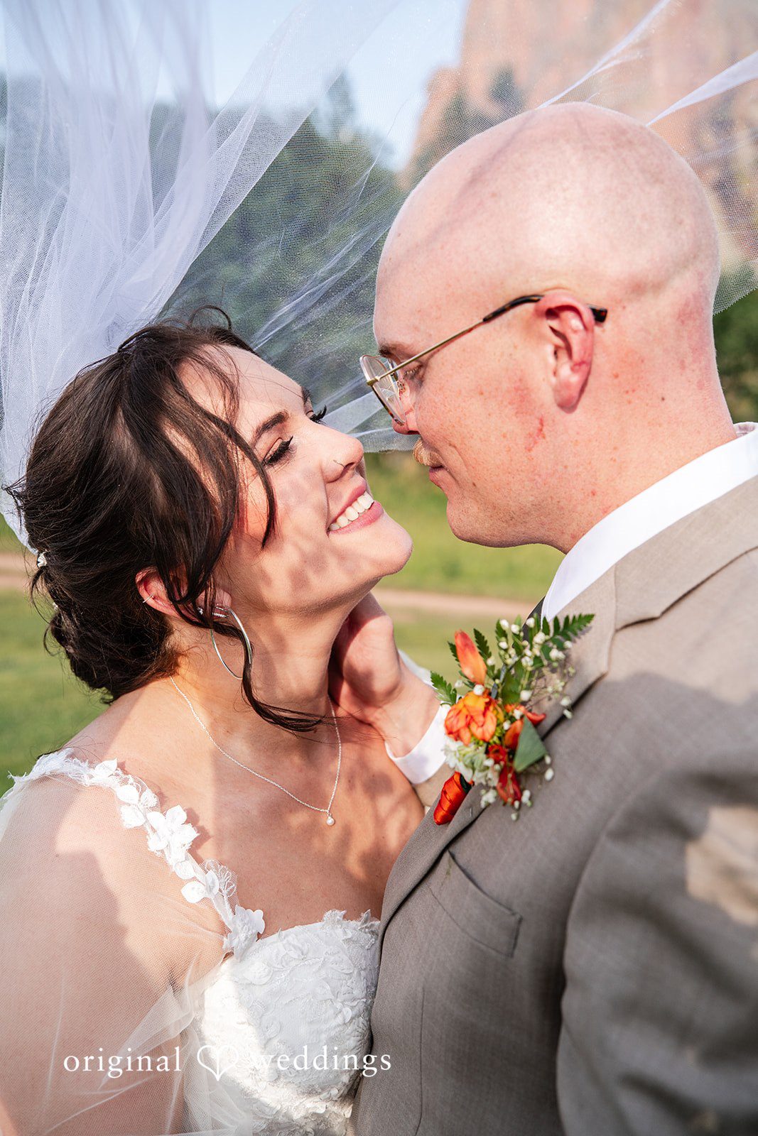 Mckenna + Ryan A close-up shot of a bride and groom looking lovingly at each other.