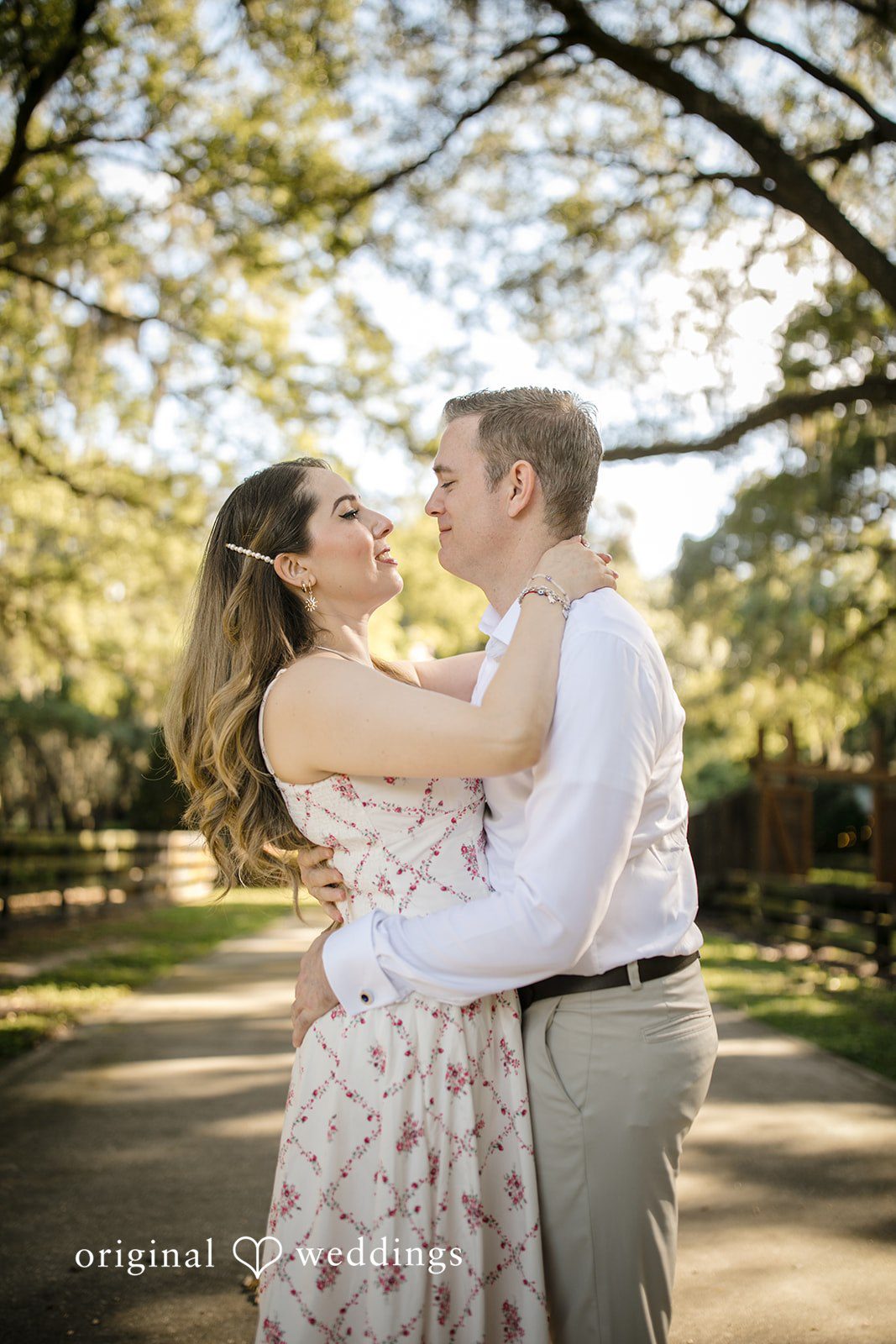 Couple embracing tightly and looking at each other.