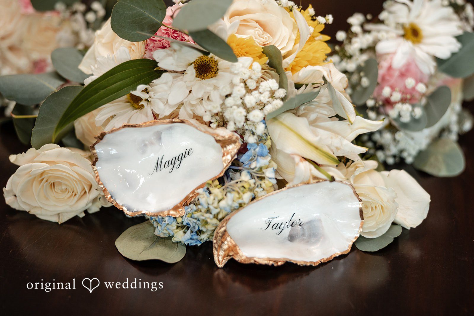 Maggie + Taylor A vibrant bouquet featuring large white, yellow, and peach wedding flowers.
