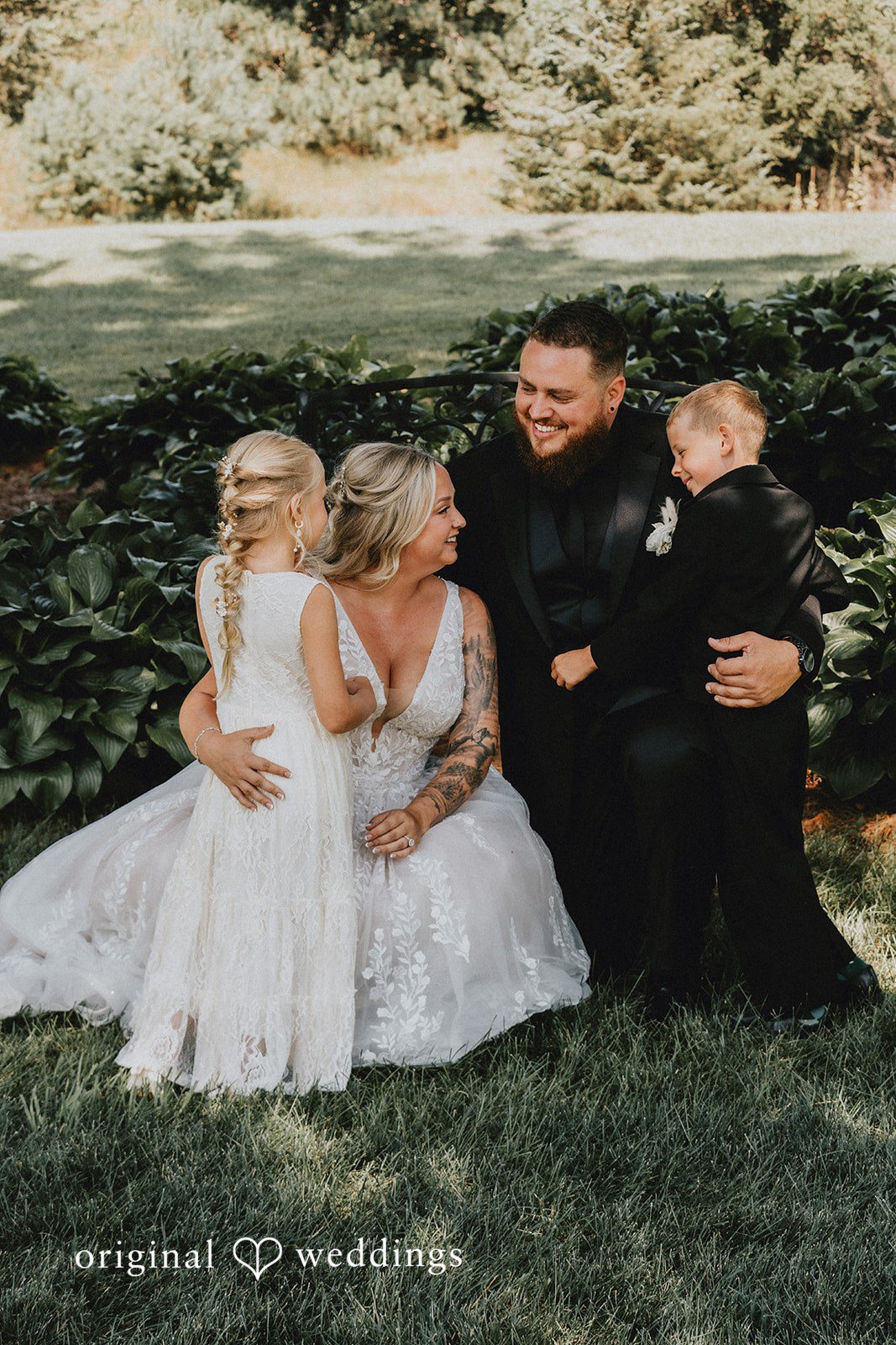 Samantha + Peyton Group photo featuring the bride, young childrens, and groom.