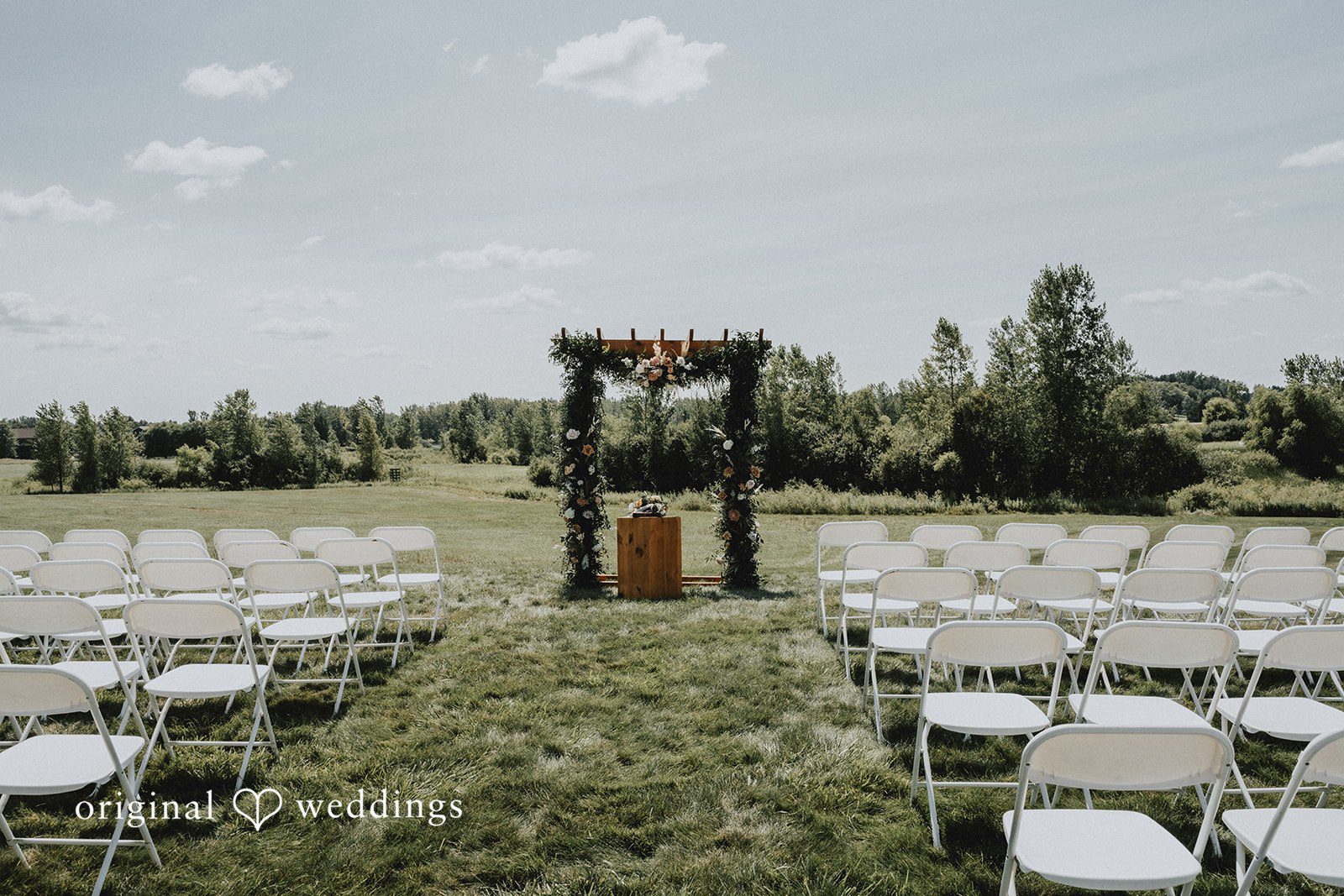 Samantha + Peyton Wedding ceremony seating arrangement facing an open altar.