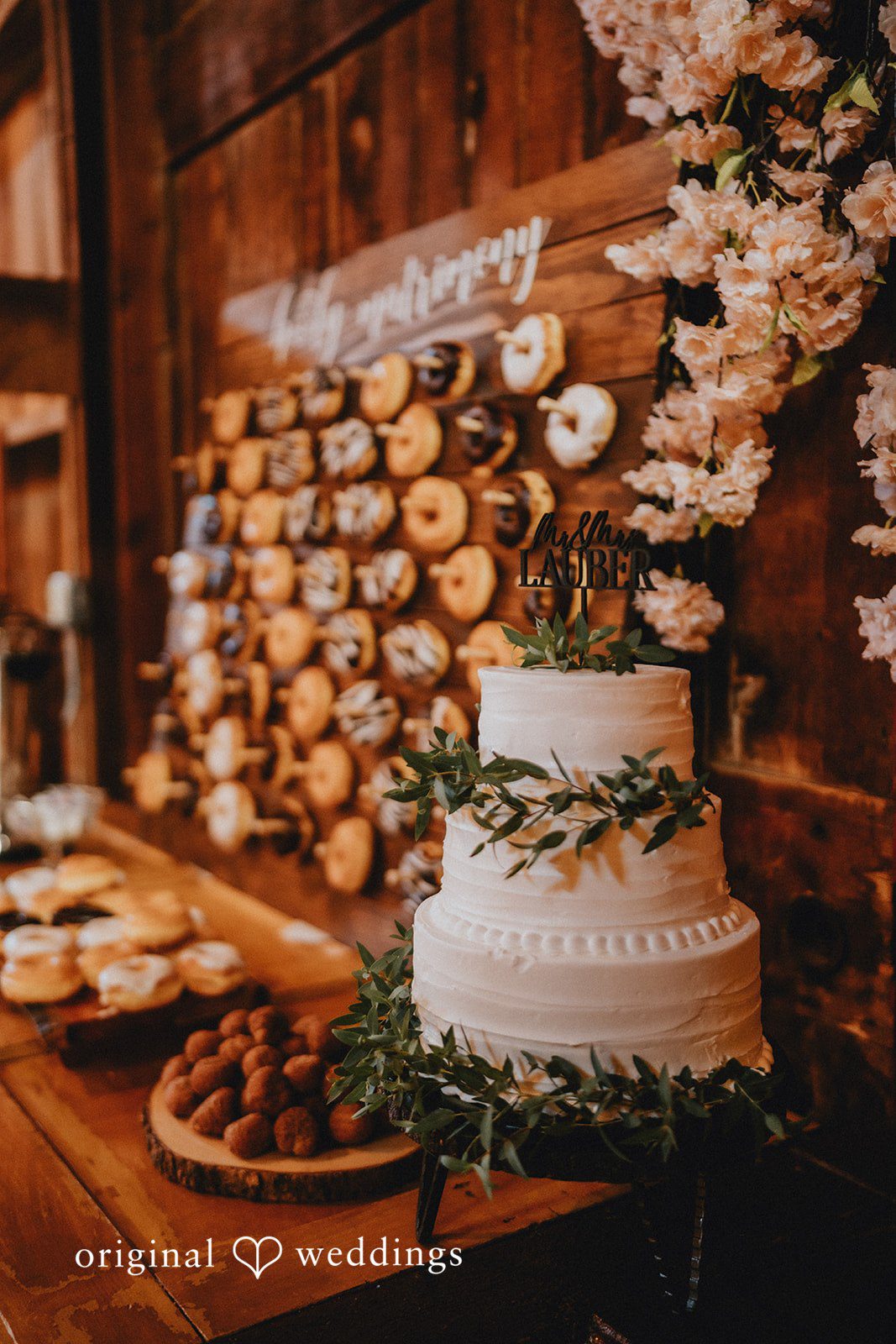 Samantha + Peyton Multi-tiered wedding cake displayed on a dessert table.