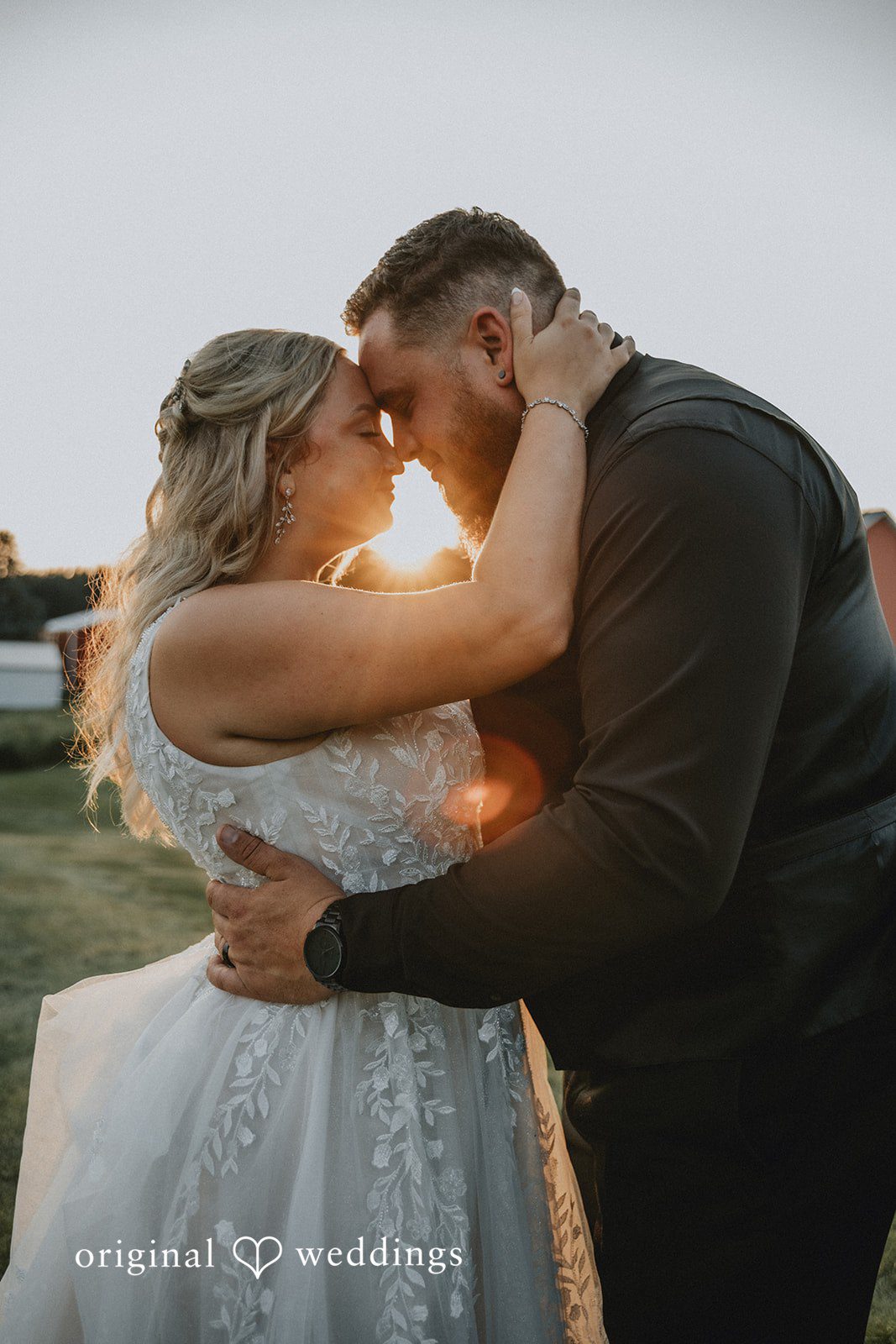 Samantha + Peyton Close-up embrace of a bride and groom during sunset lighting.