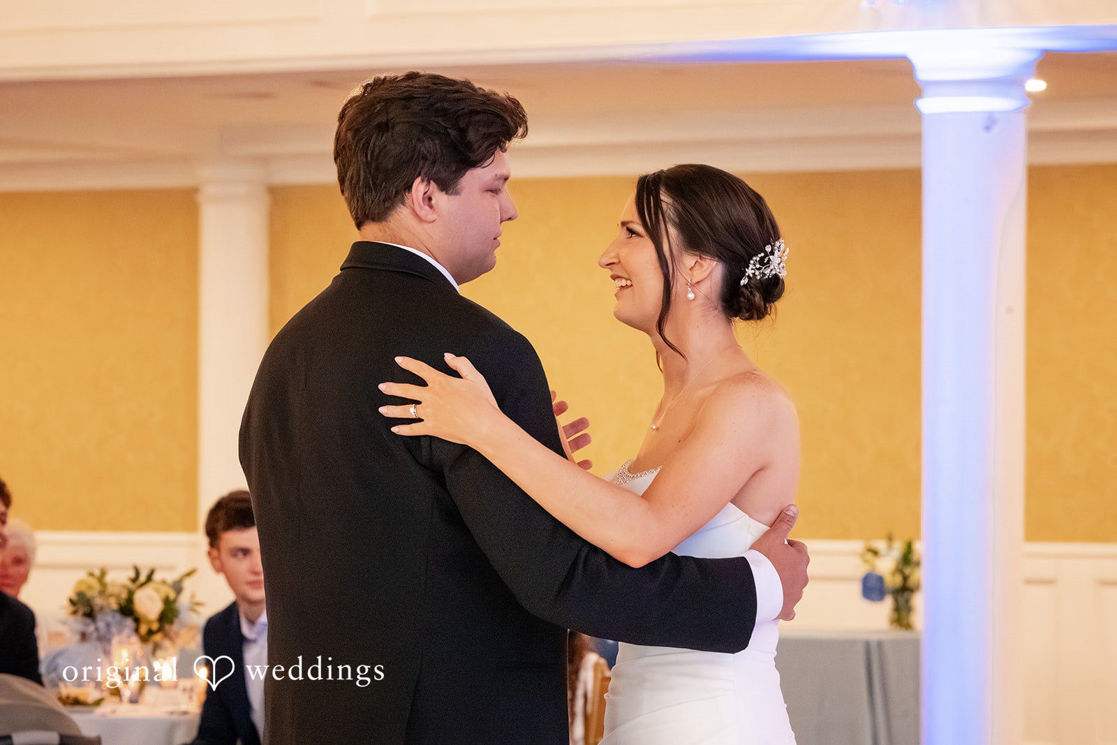 Mark + Caroline The groom embracing and dancing with his bride during their wedding reception.