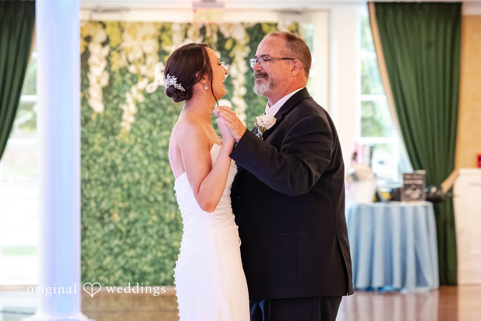 Mark + Caroline The groom smiling while sharing a dance with an older woman during the reception.