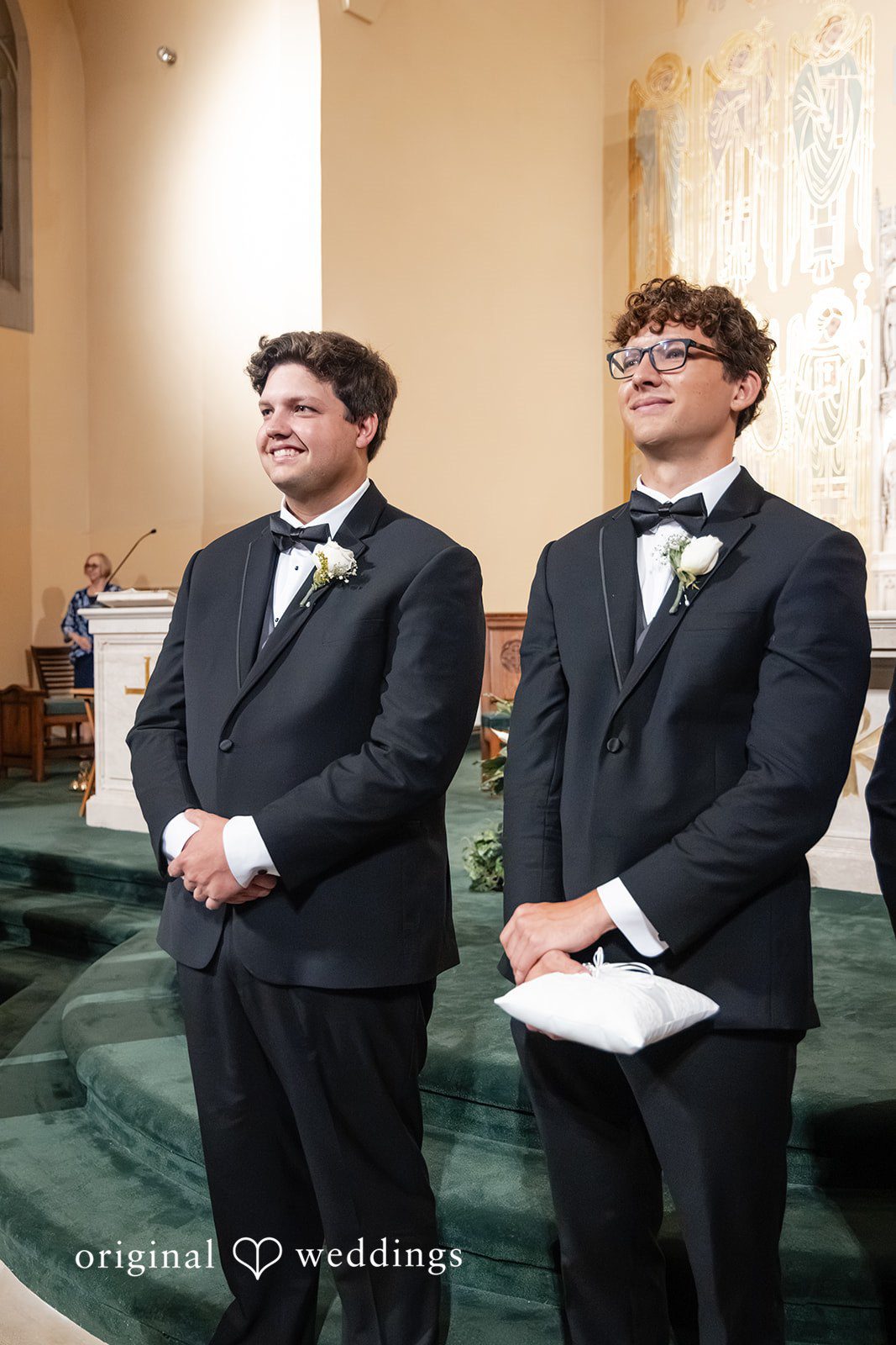 Mark + Caroline A groom standing at the altar with his best man awaiting the ceremony.