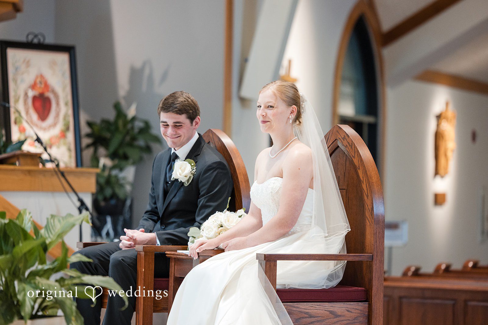 Cora + Michael Beautiful couple sitting wedding moment at the Emerald Event Center