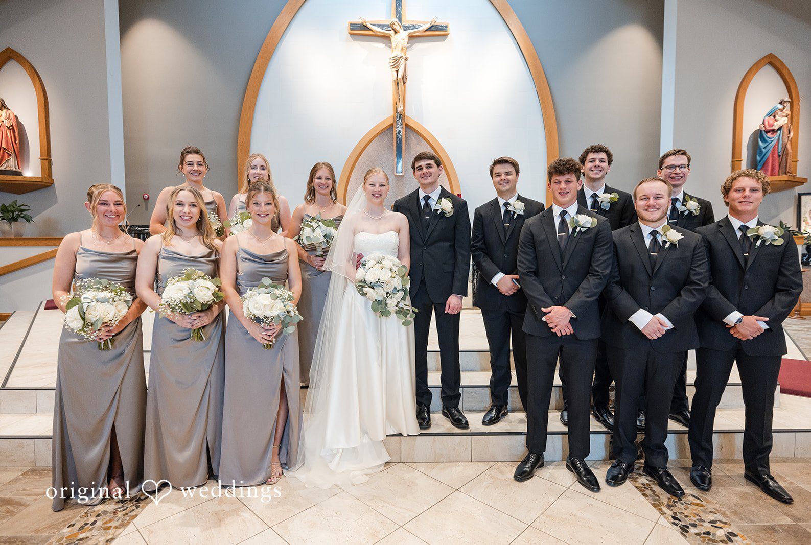 Cleveland Wedding Photographers capturing couple group photo with bridesmaids and groomsmen at the Emerald Event Center by Original Weddings