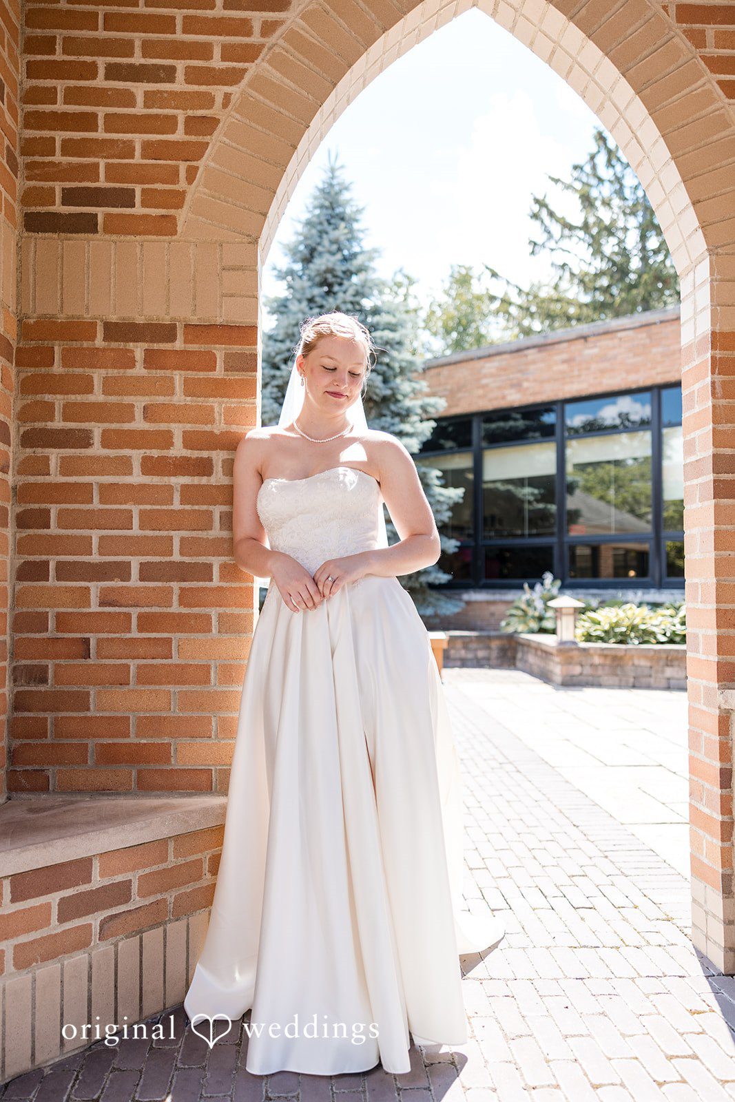 Cora + Michael Elegant bride solo portrait at the Emerald Event Center