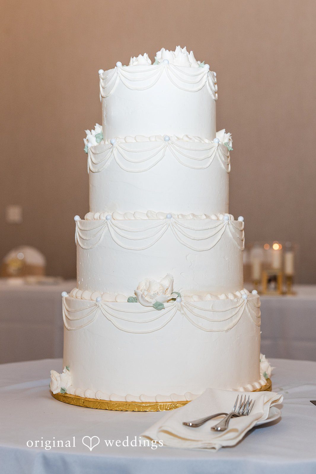 Cora + Michael Romantic wedding cake display at the Emerald Event Center
