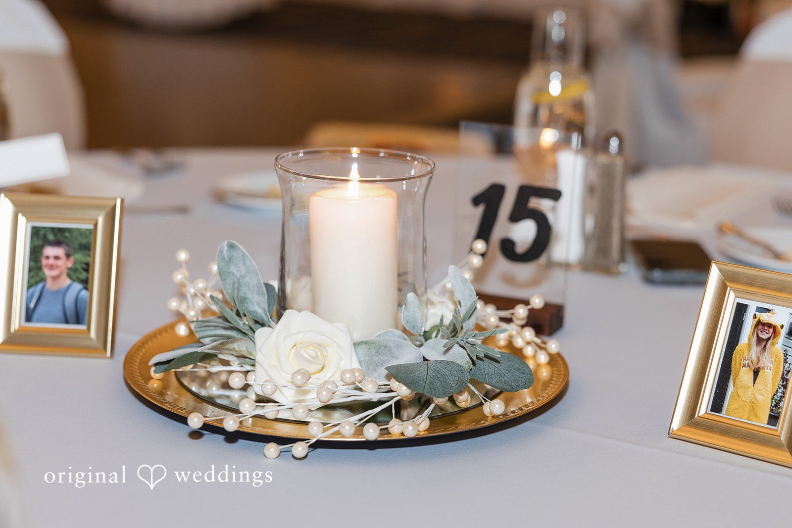 Cora + Michael Elegant plate flowers and candle decoration at the Emerald Event Center