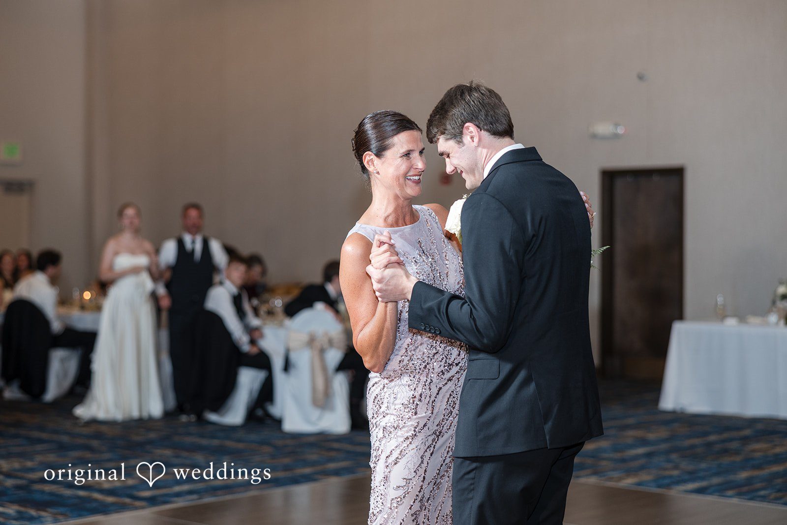 Cora + Michael Joyful groom celebration moment while dancing with someone at the Emerald Event Center