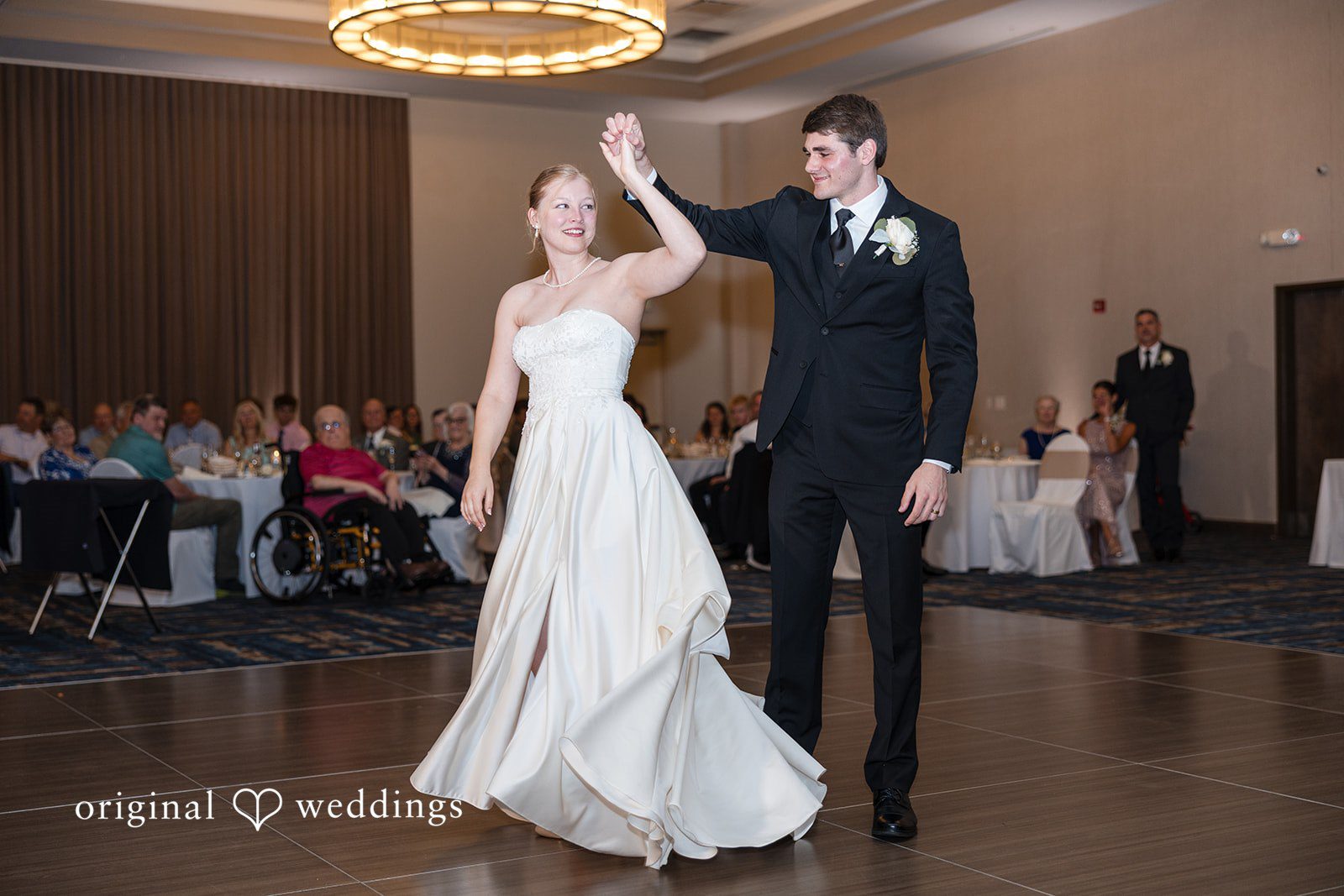 Cora + Michael Cleveland Wedding Photographers capturing couple dancing in a romantic way at the Emerald Event Center by Original Weddings