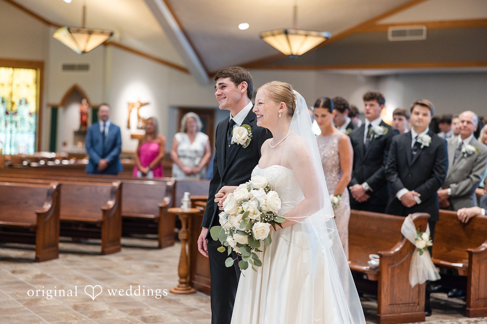 Cora + Michael Elegant bride and groom standing together at the Emerald Event Center