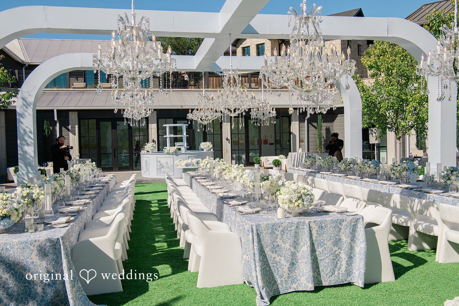 Mehul + Nazanin Huge chandeliers against decorated tables