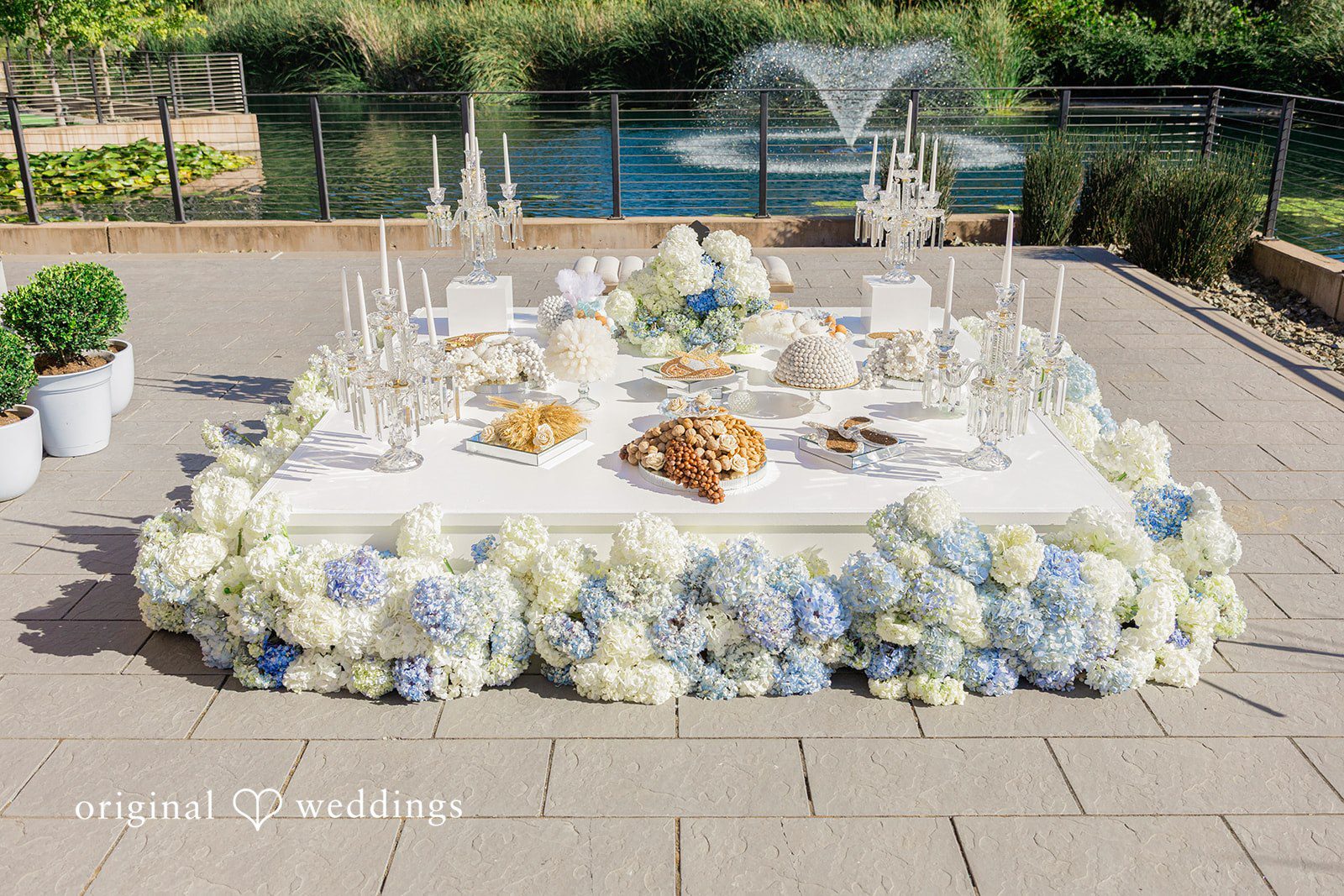 Mehul + Nazanin Table having some snacks and decorated with huge flowerflowerss