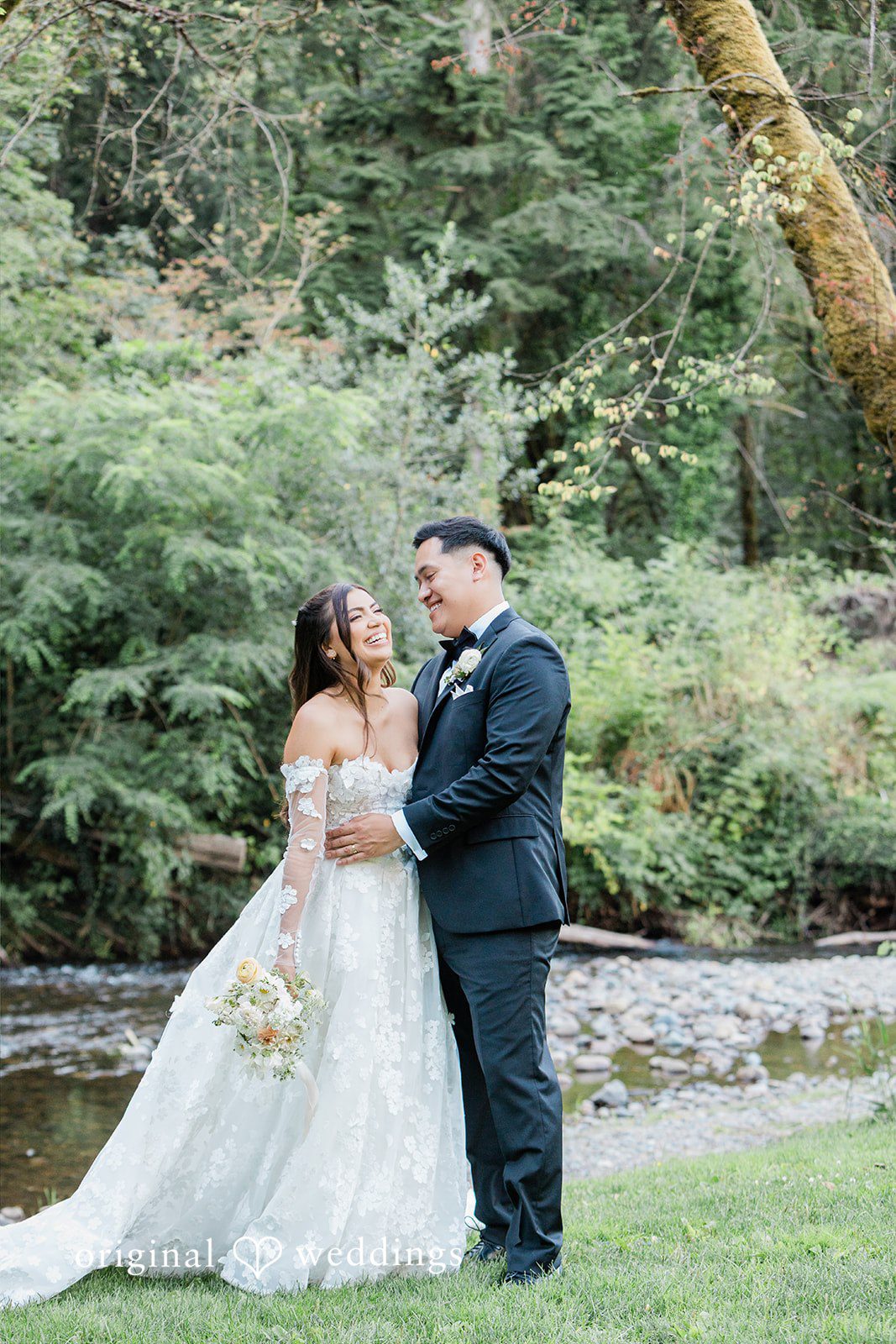 Bride and groom smiling and laughing together.