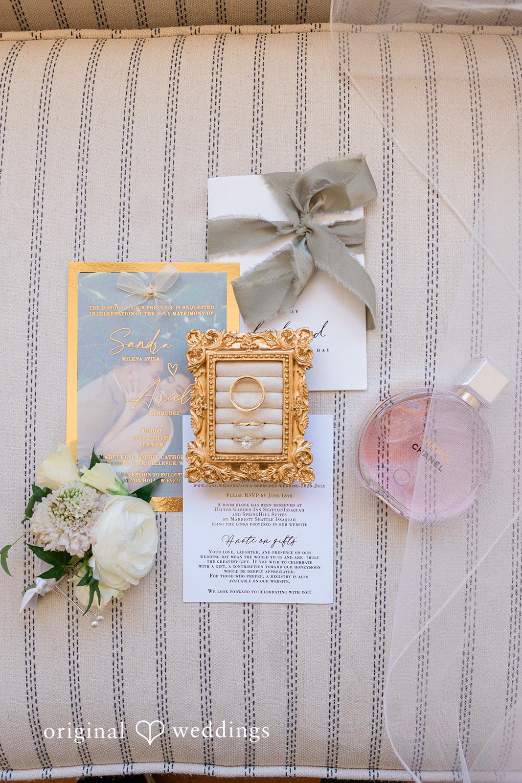 Rustic wooden backdrop decorated with frames and floral wreaths.
