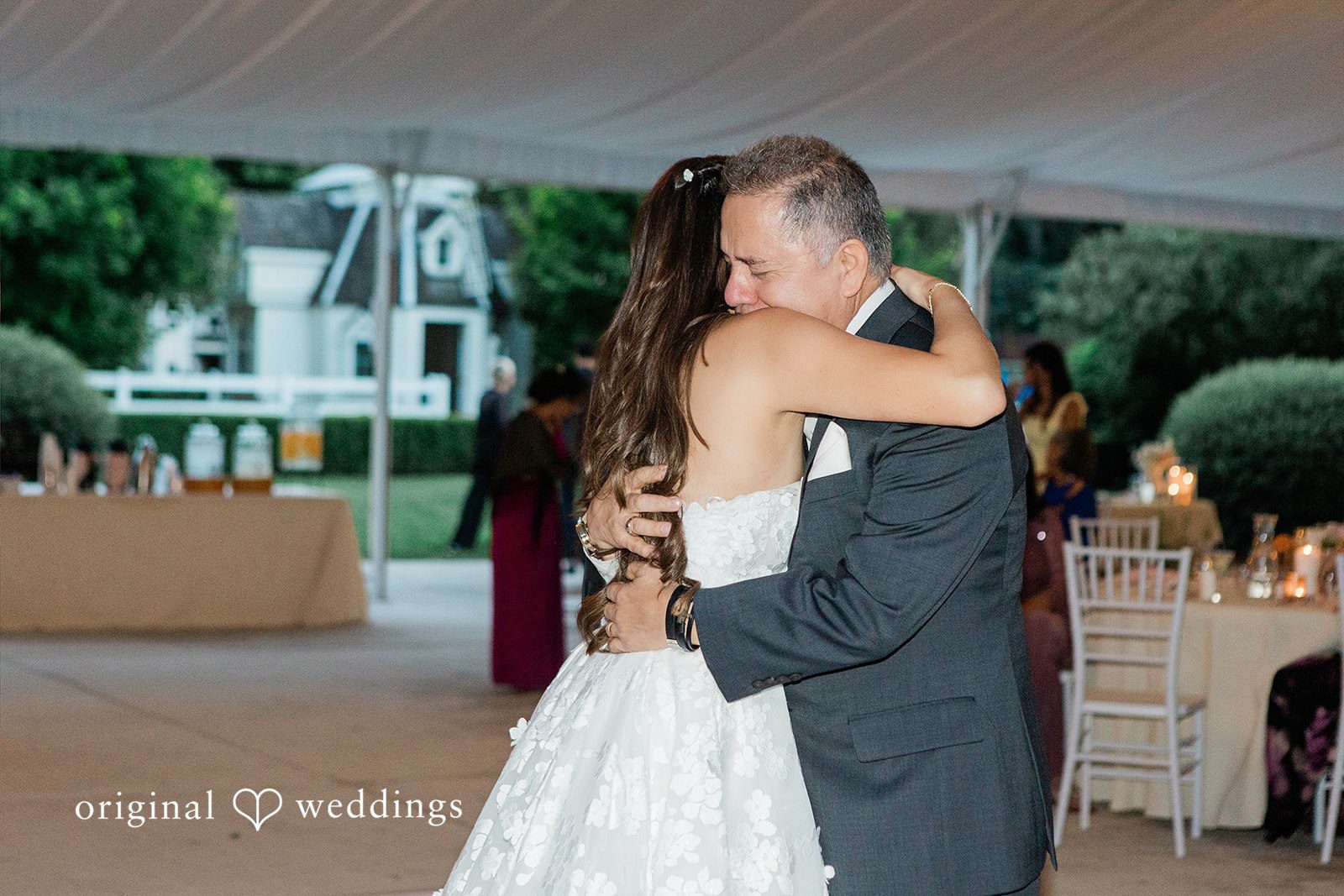 Bride and man crying during a dance.