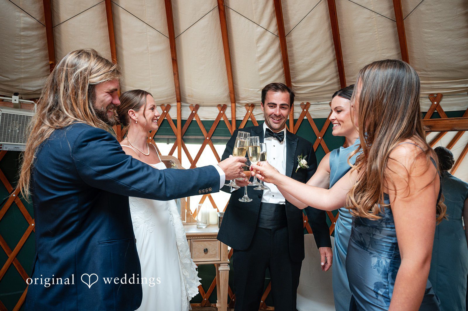 Emilia + Charlie A bride and groom celebrating with guests during a lively reception.