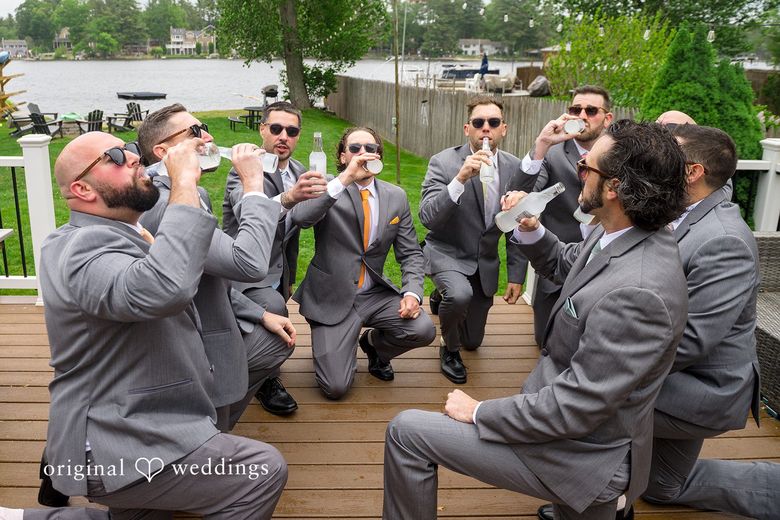 Alex + Courtney Groomsmen playfully celebrating together during a photo shoot.