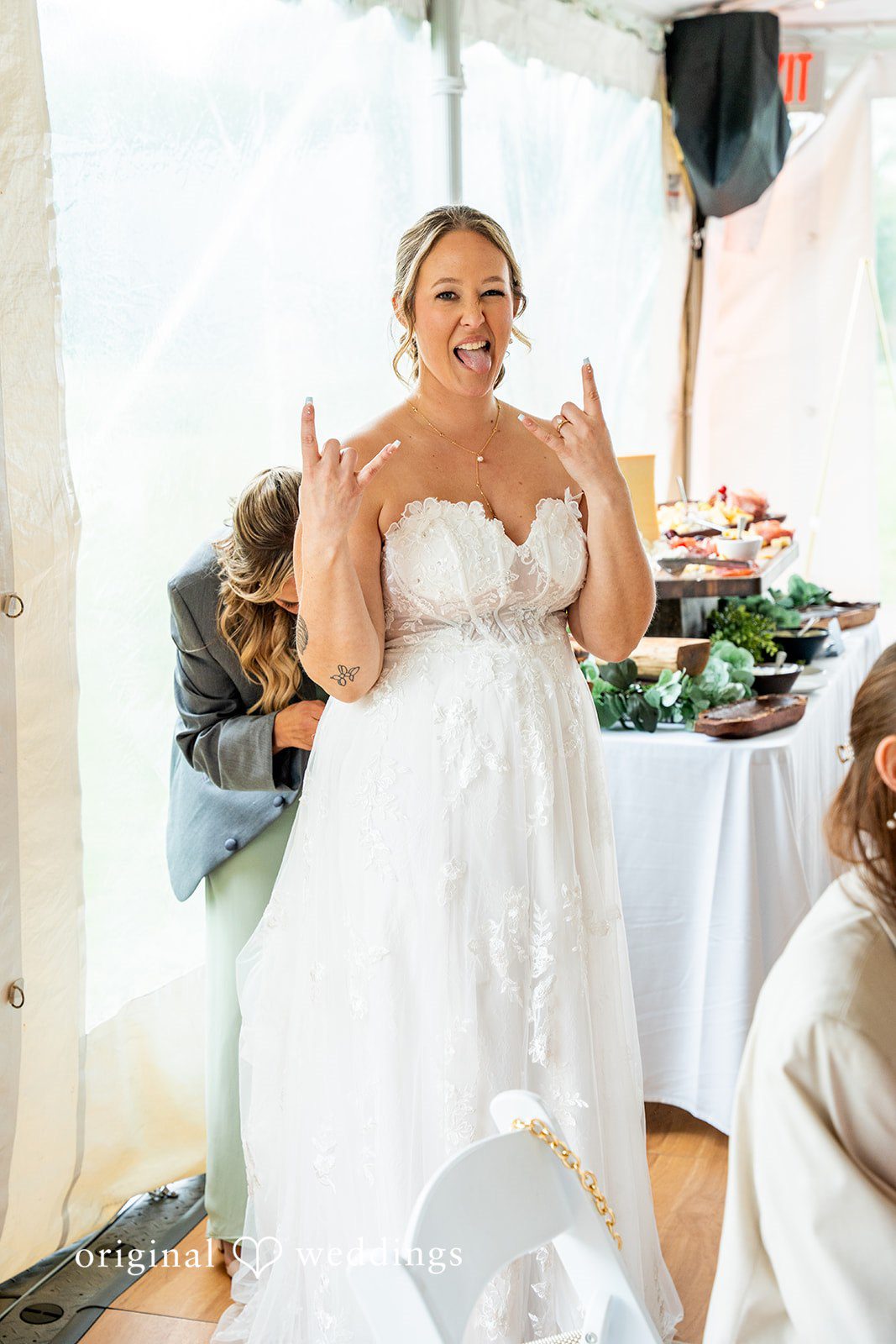 Alex + Courtney A bride laughing playfully while making a funny face.