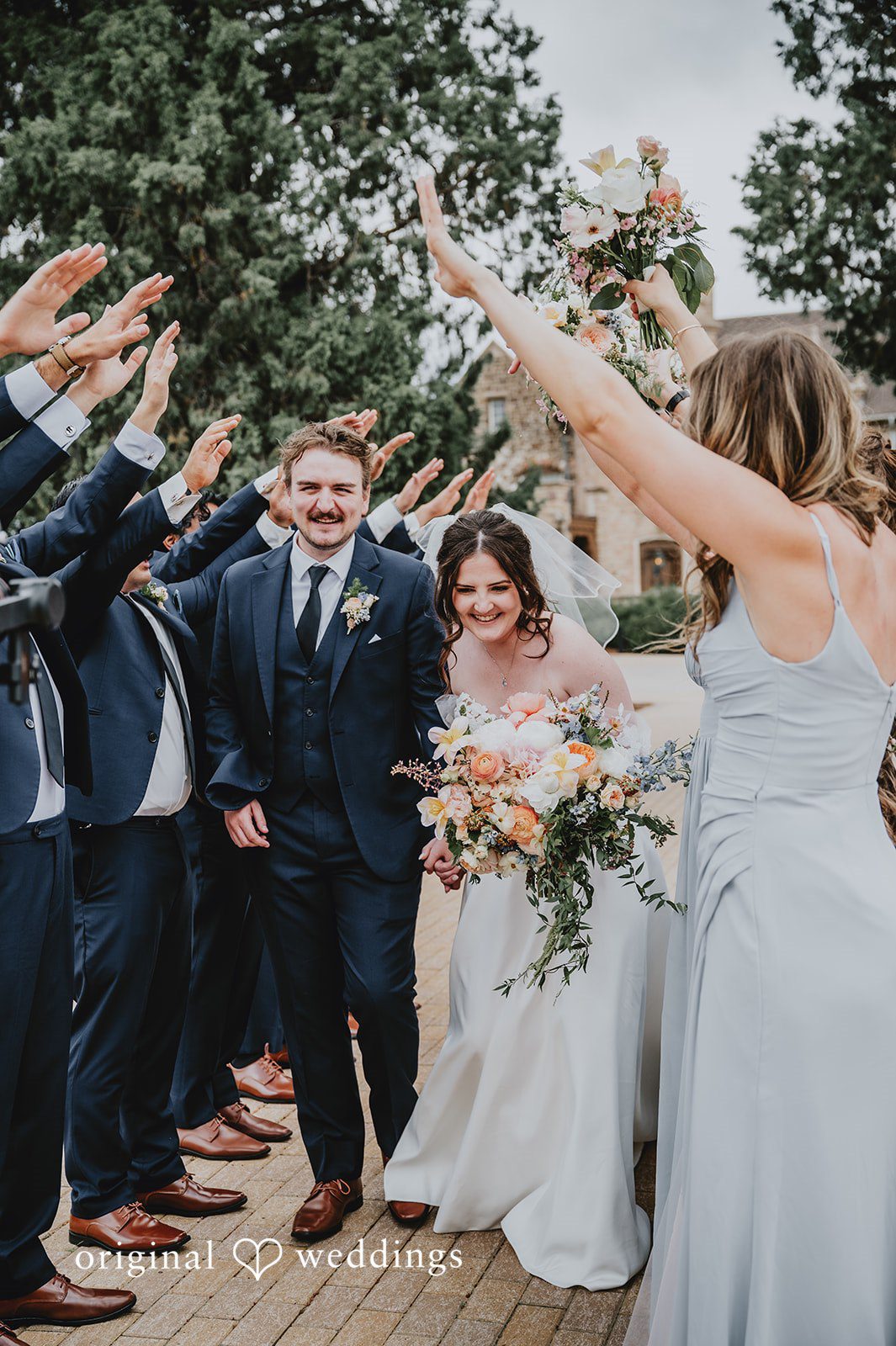 Wedding guests cheering the newlyweds at Highlands Ranch Mansion.
