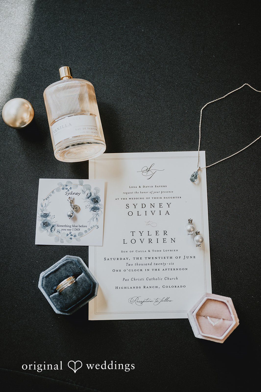 Modern wedding invitation suite laid out with elegant typography and custom wax seals.