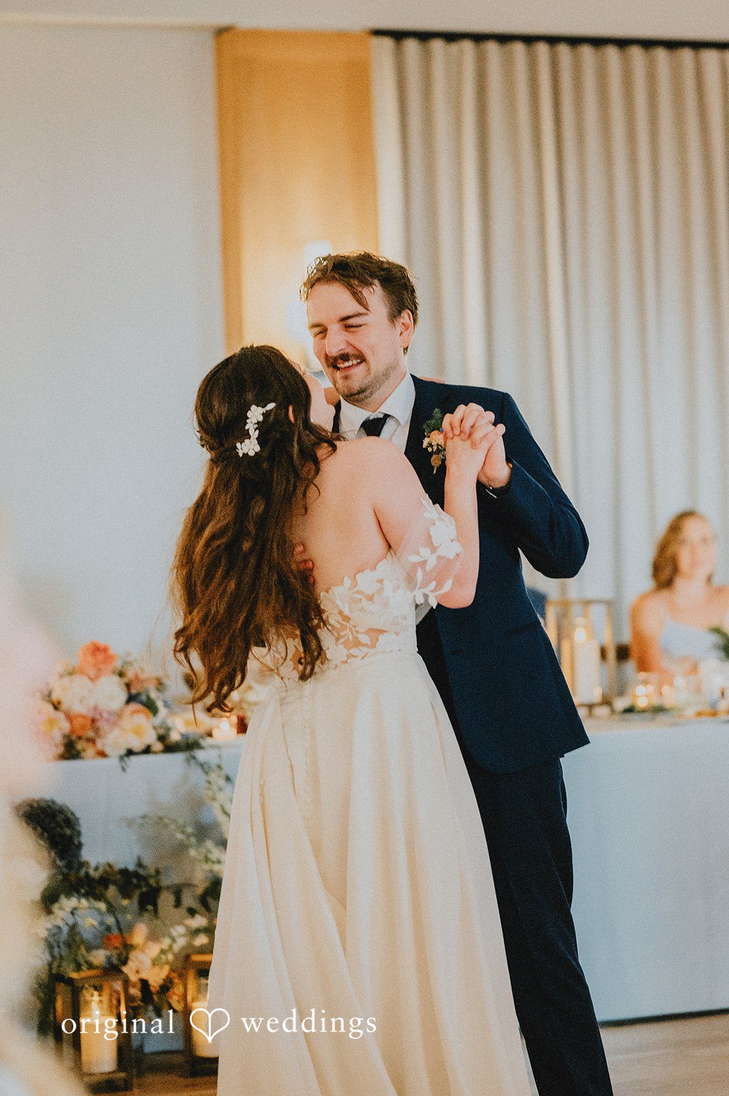 Bride and groom sharing their first dance together at the wedding reception.