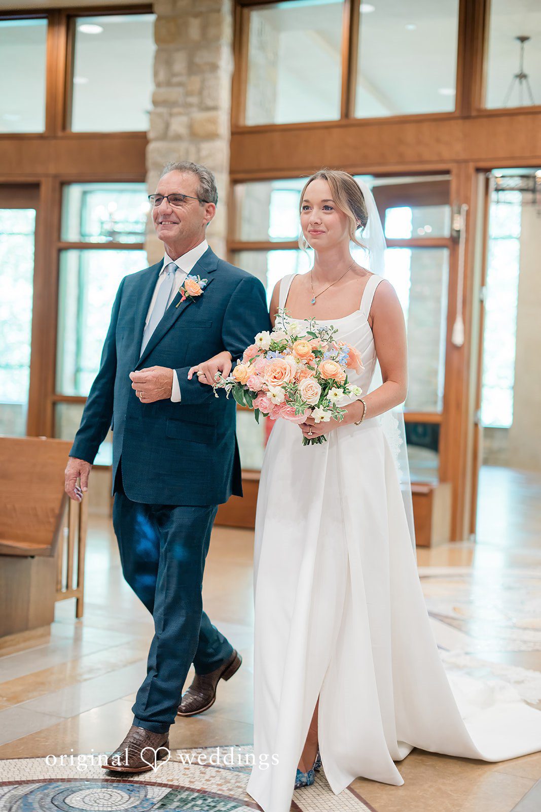 Andrew + Lyndsey The bride's father escorts the bride down the aisle