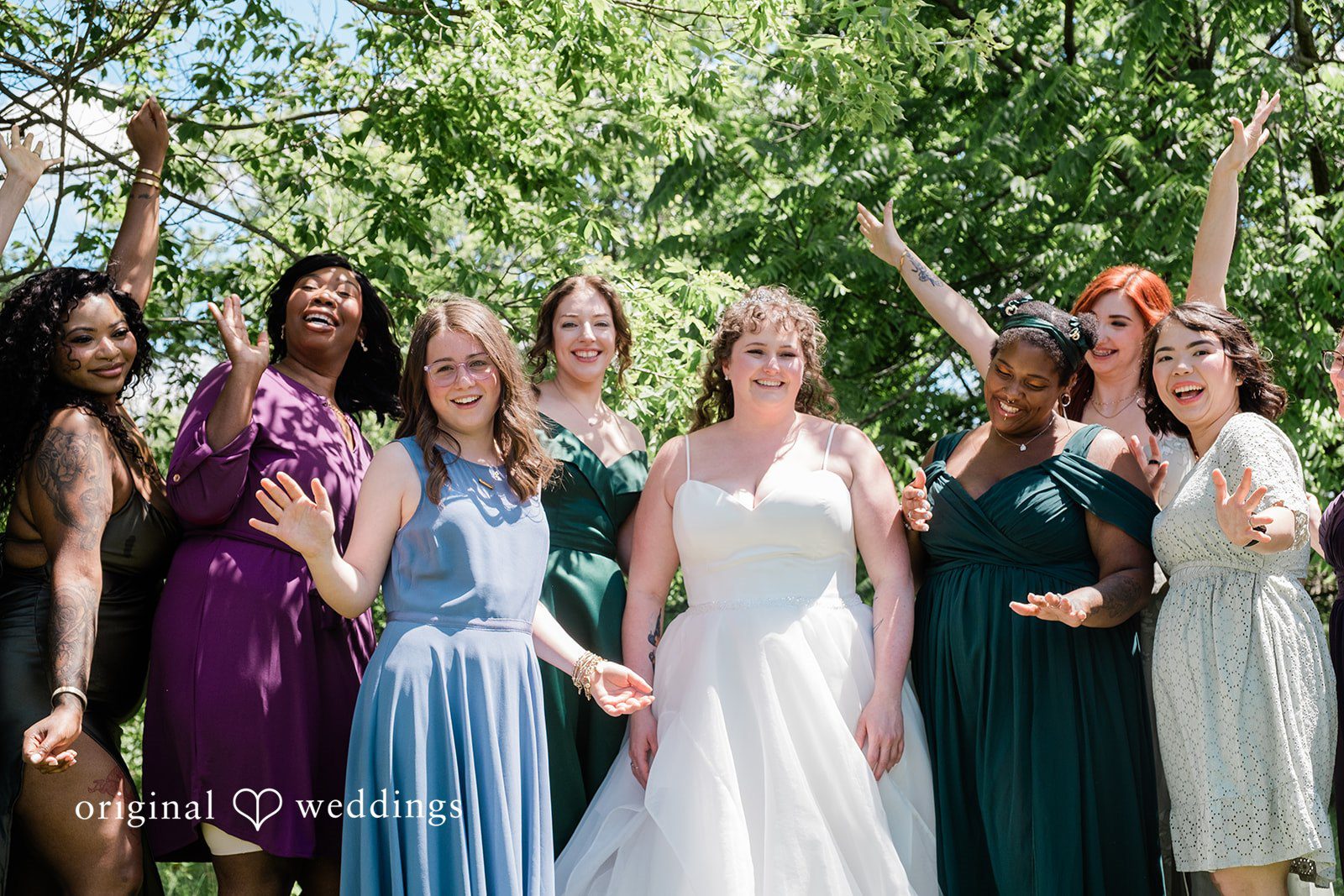 Carly + Seamus Bride and bridesmaids stand alongside the car.