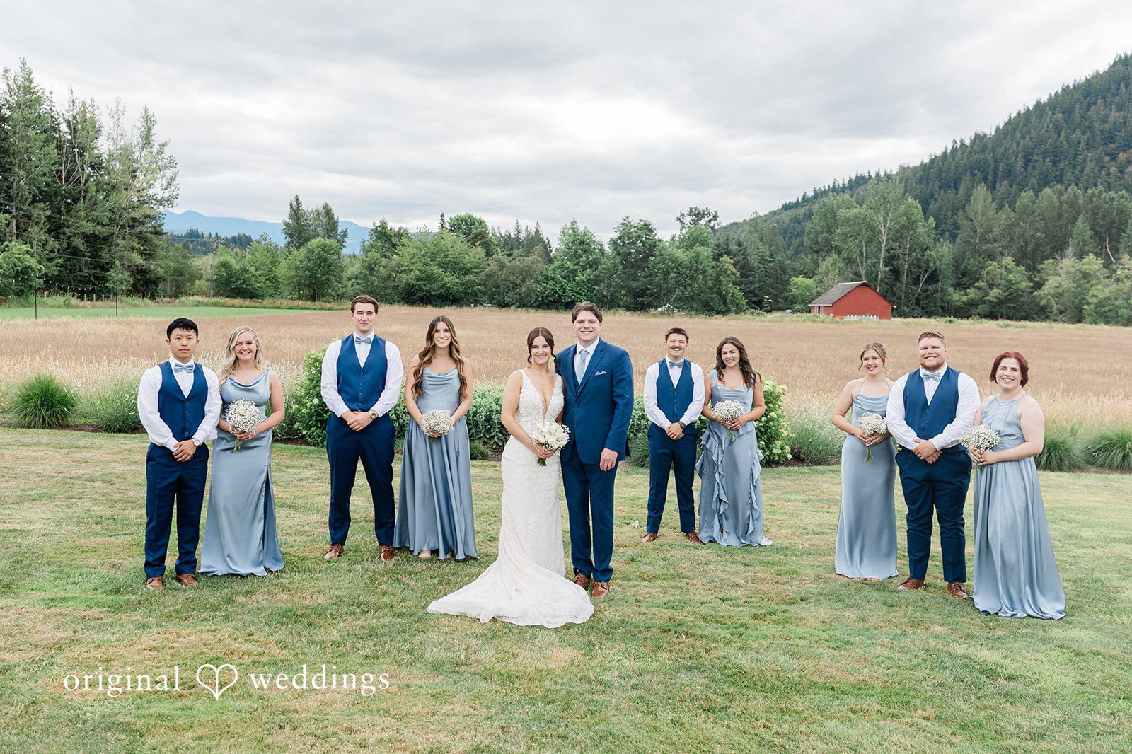 Our Seattle wedding photographers at Original Weddings captured a stunning portrait of the couple and their bridal party at Mount Peak Farm