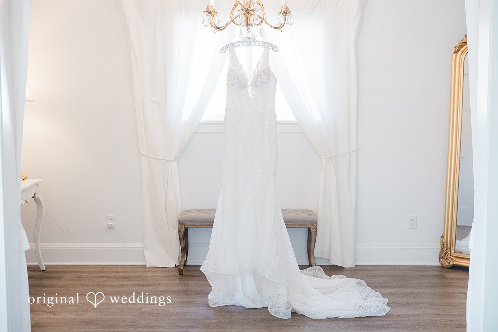 Jaelynn + Jayden The bride's gown gracefully hanging in the lodge