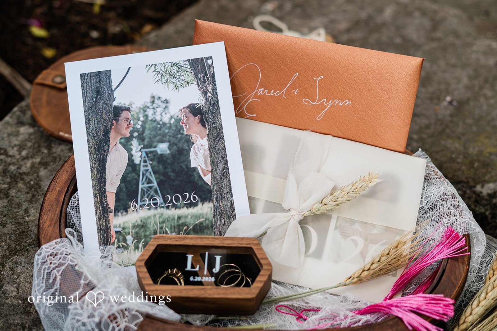 Lovely placement of wedding cards along with couples picture
