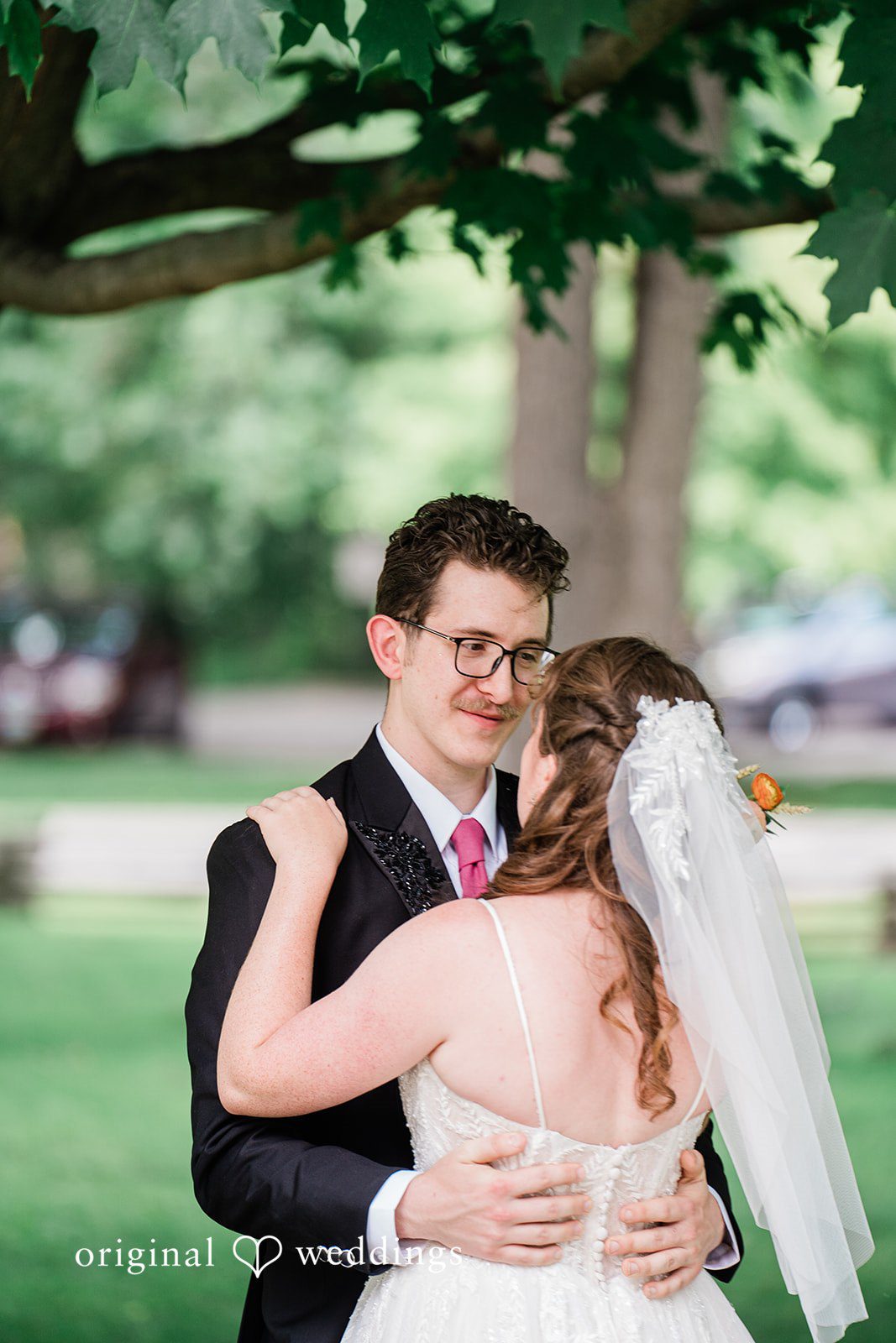 A candid hug moment of couple in a backyard
