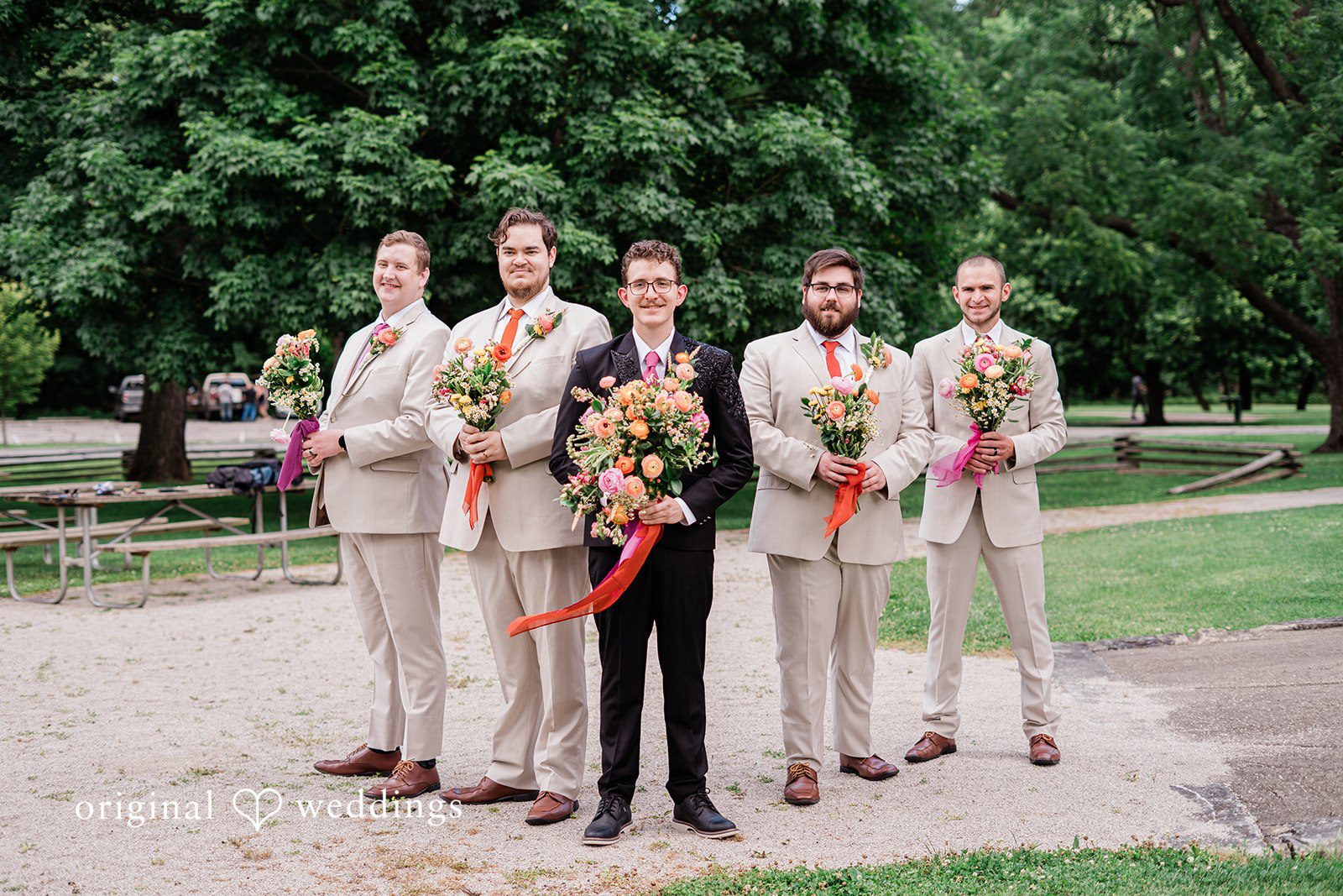 Elegant picture of groom with groomsmen posing for wedding photography