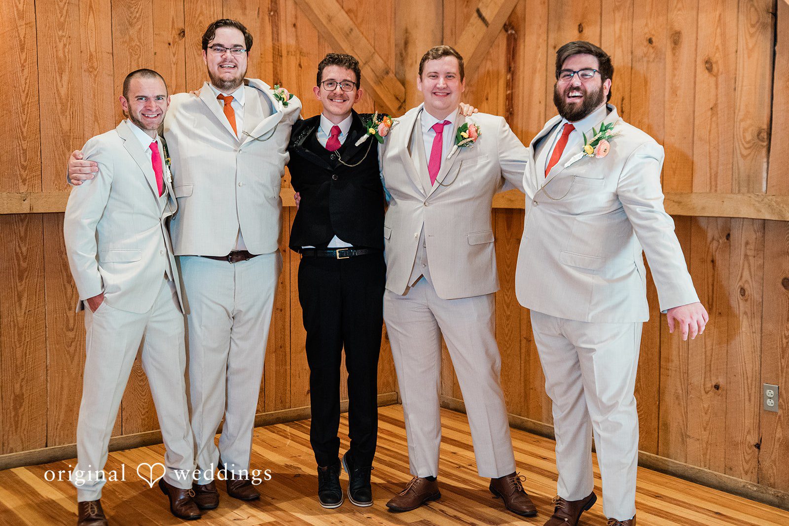 Elegant picture of groom with groomsmen posing for wedding photography