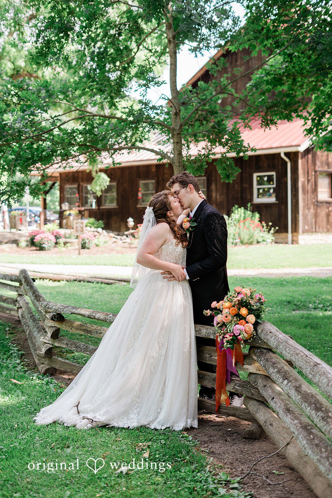 Bride and groom sharing a romantic kiss